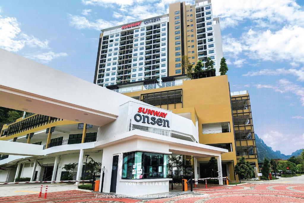 a building with a sign that reads summary queen at Onsen Premium Suites @ Tambun Ipoh in Ipoh