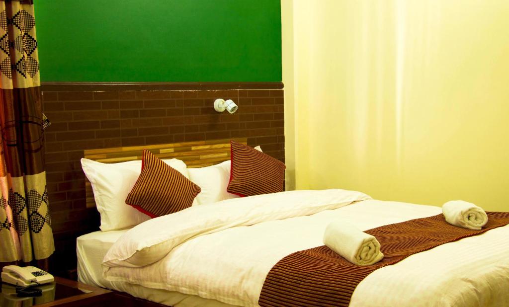 Cama o camas de una habitación en Hotel Adam
