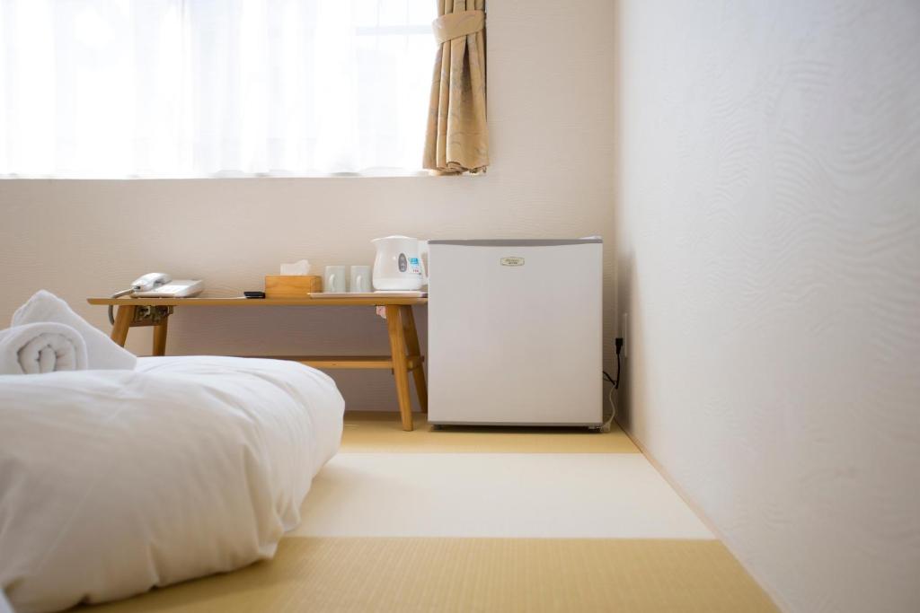 Postel nebo postele na pokoji v ubytování Dotonbori Shinsaibashi Hotel