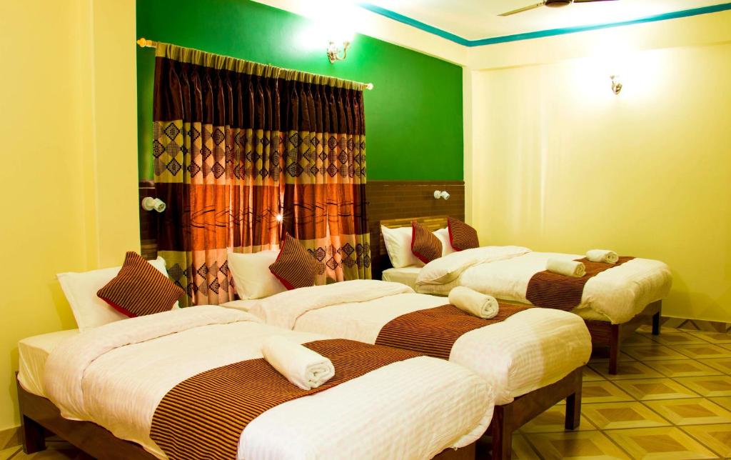 Cama o camas de una habitación en Hotel Adam