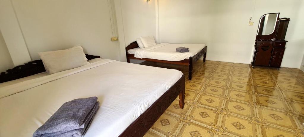 Postel nebo postele na pokoji v ubytování Khmer House Guesthouse