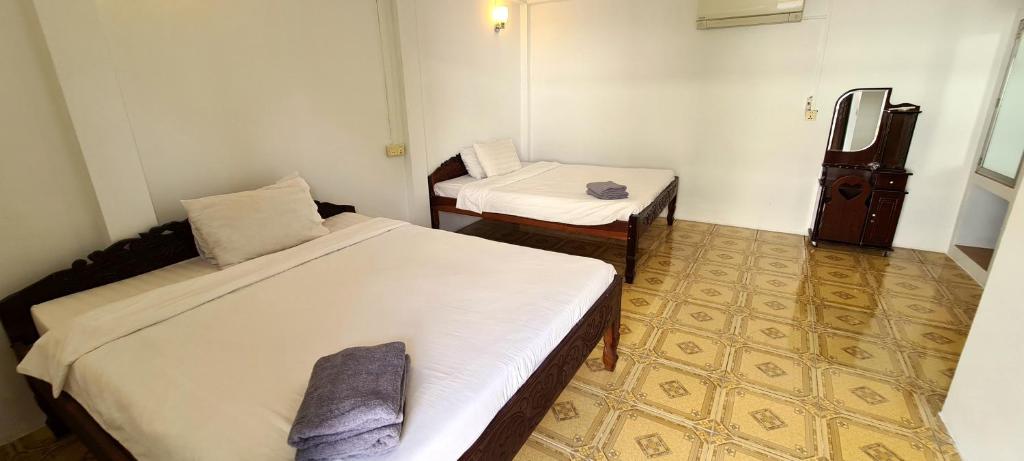 Postel nebo postele na pokoji v ubytování Khmer House Guesthouse
