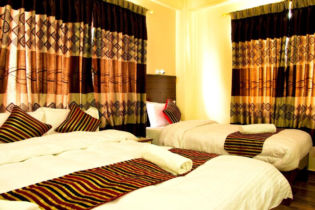 Cama o camas de una habitación en Hotel Adam