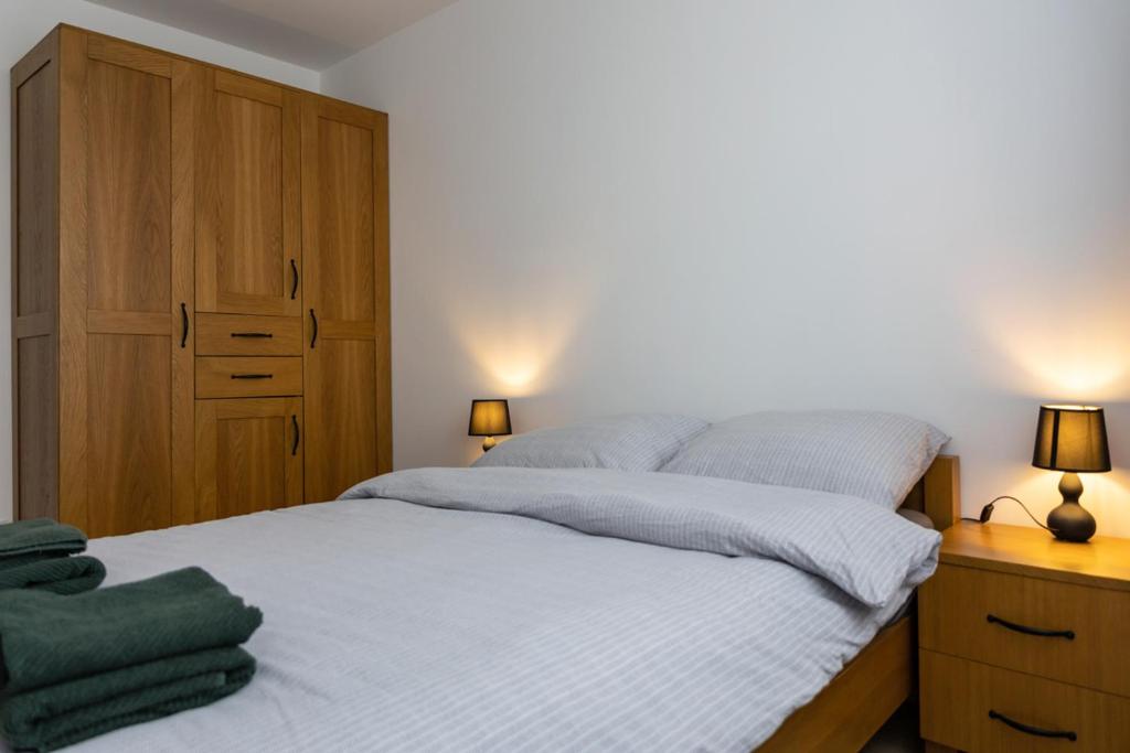Postel nebo postele na pokoji v ubytování Apartament przy PILECKIEGO 33
