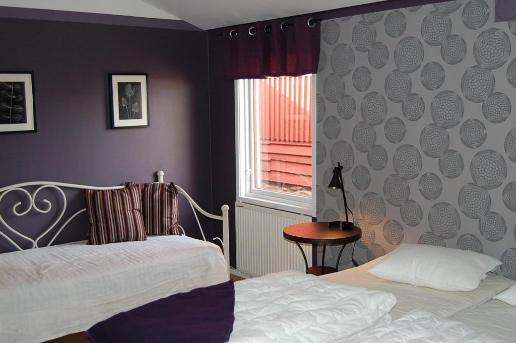 Postel nebo postele na pokoji v ubytování Vånga Hostel