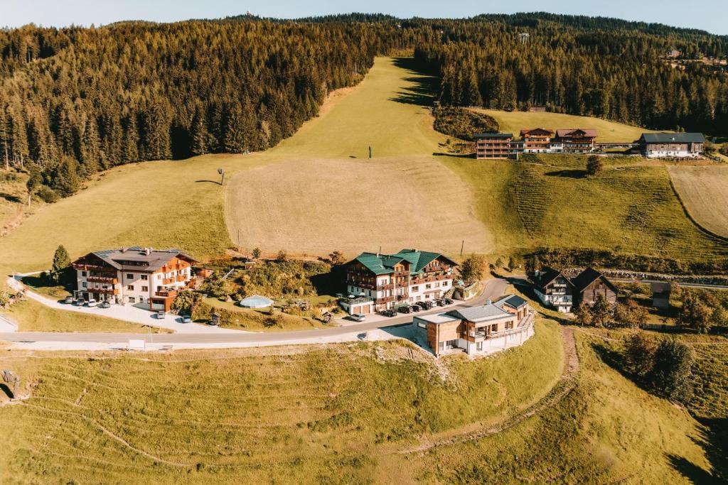 an aerial view of a house on a hill at Posers Bergwelt in Schladming