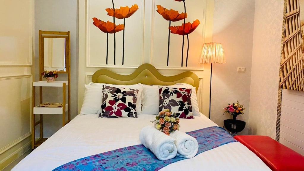 Postel nebo postele na pokoji v ubytování Linla House Bangkok