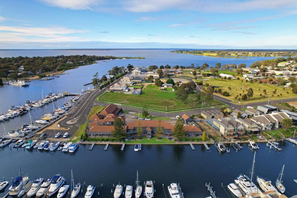 an aerial view of a marina with boats in the water at Mariners Cove at Paynesville in Paynesville