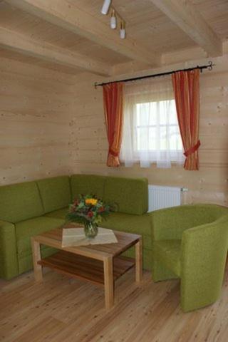 A seating area at Achenseer Hüttendörfl