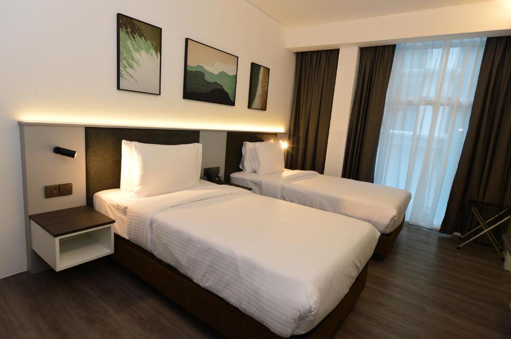 Postel nebo postele na pokoji v ubytování Rume Hotel
