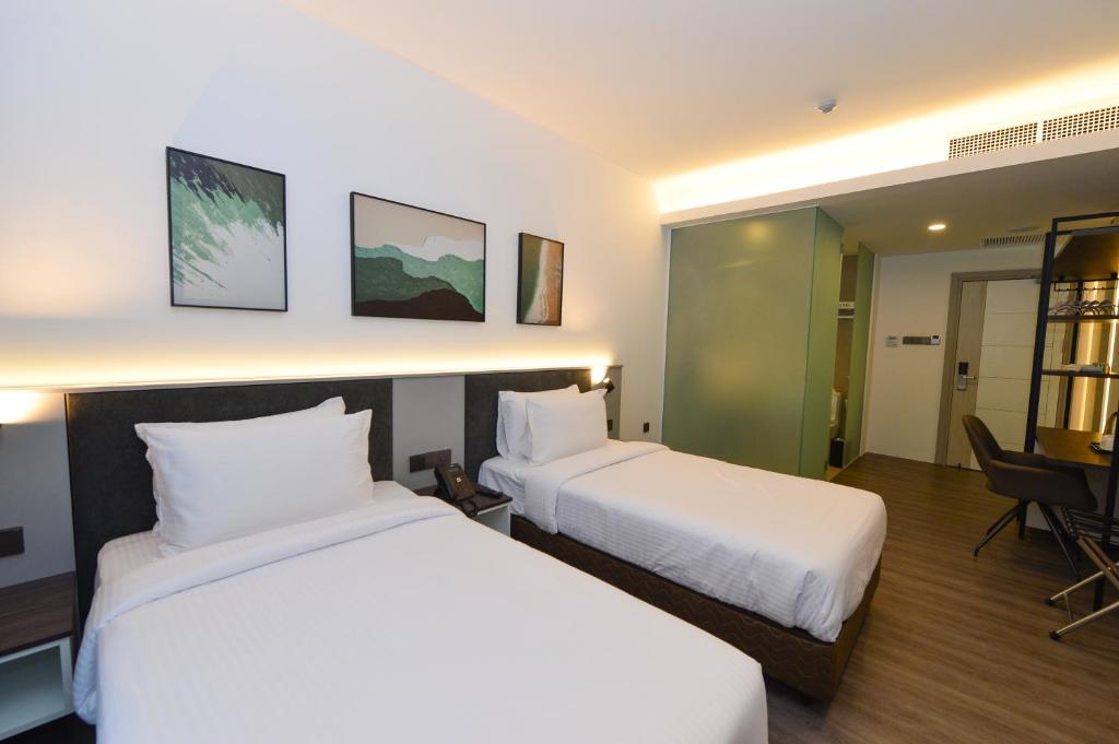 Postel nebo postele na pokoji v ubytování Rume Hotel