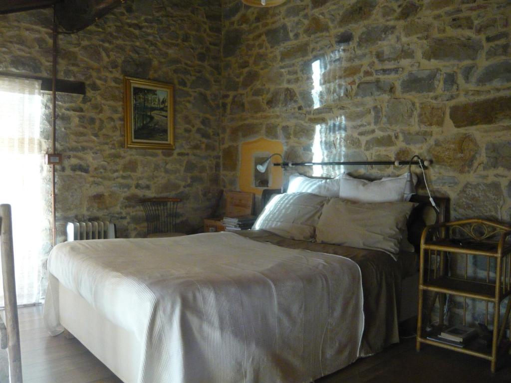 Ліжко або ліжка в номері Agriturismo Petrarosa