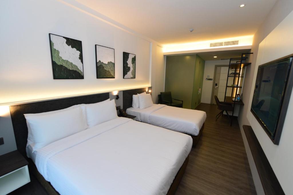Postel nebo postele na pokoji v ubytování Rume Hotel