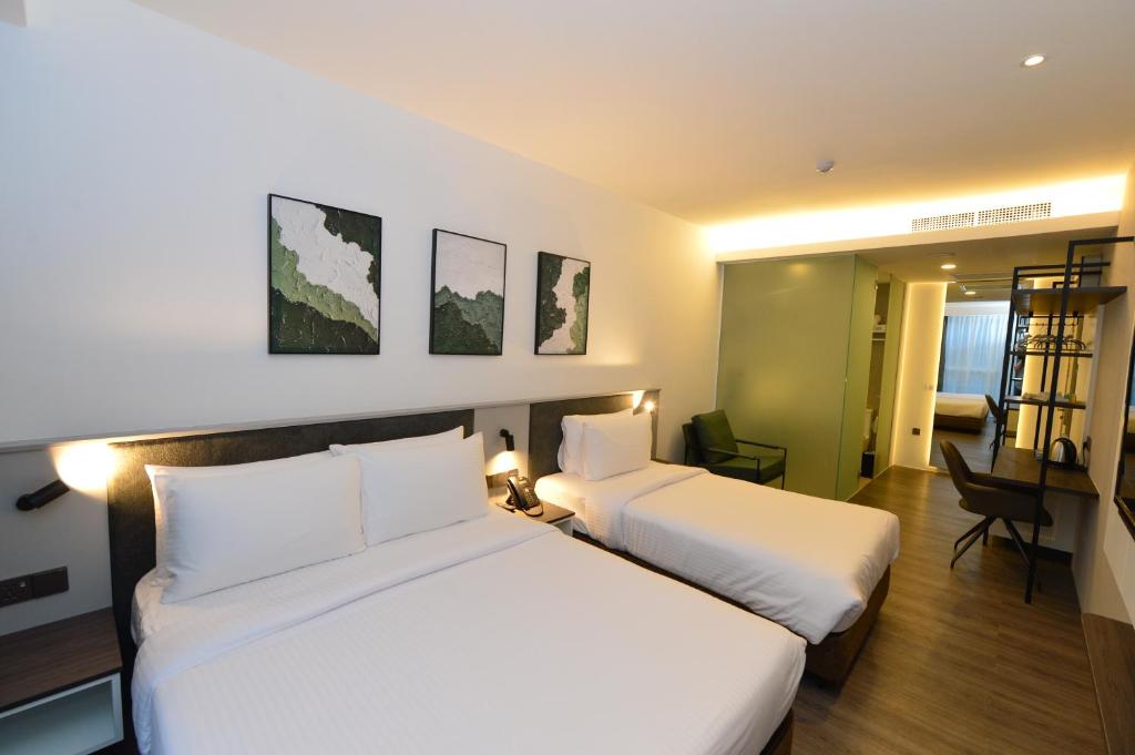 Postel nebo postele na pokoji v ubytování Rume Hotel