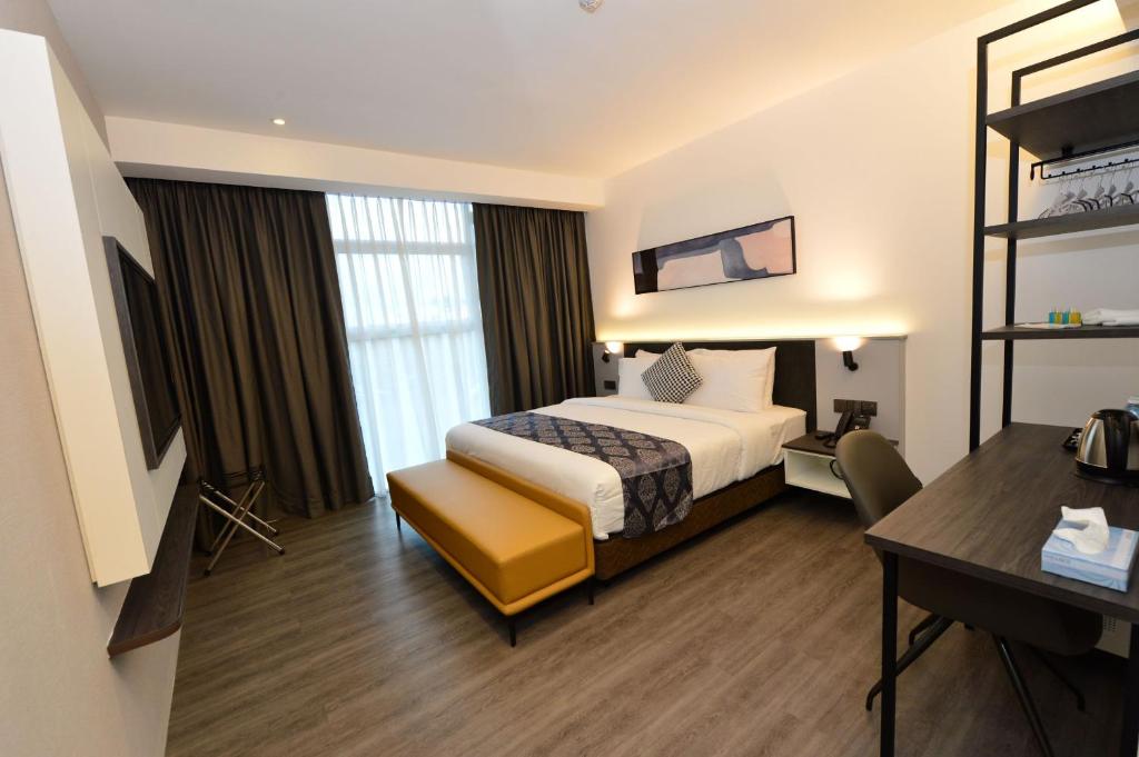 Postel nebo postele na pokoji v ubytování Rume Hotel