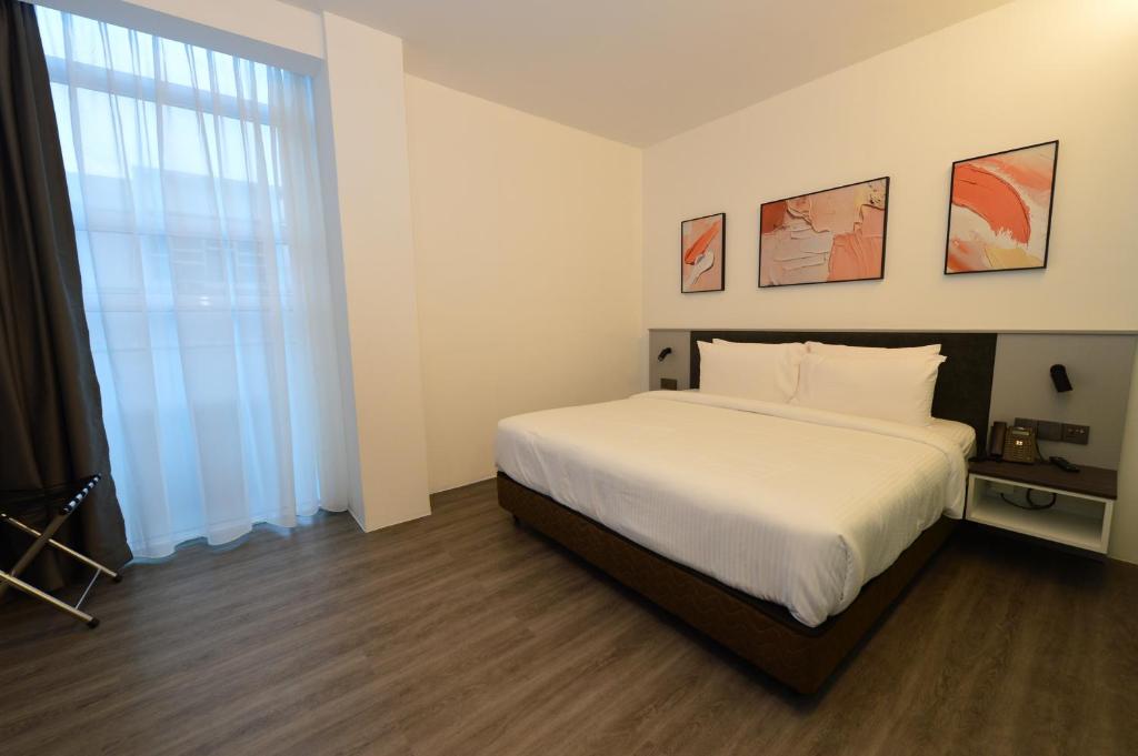 Postel nebo postele na pokoji v ubytování Rume Hotel