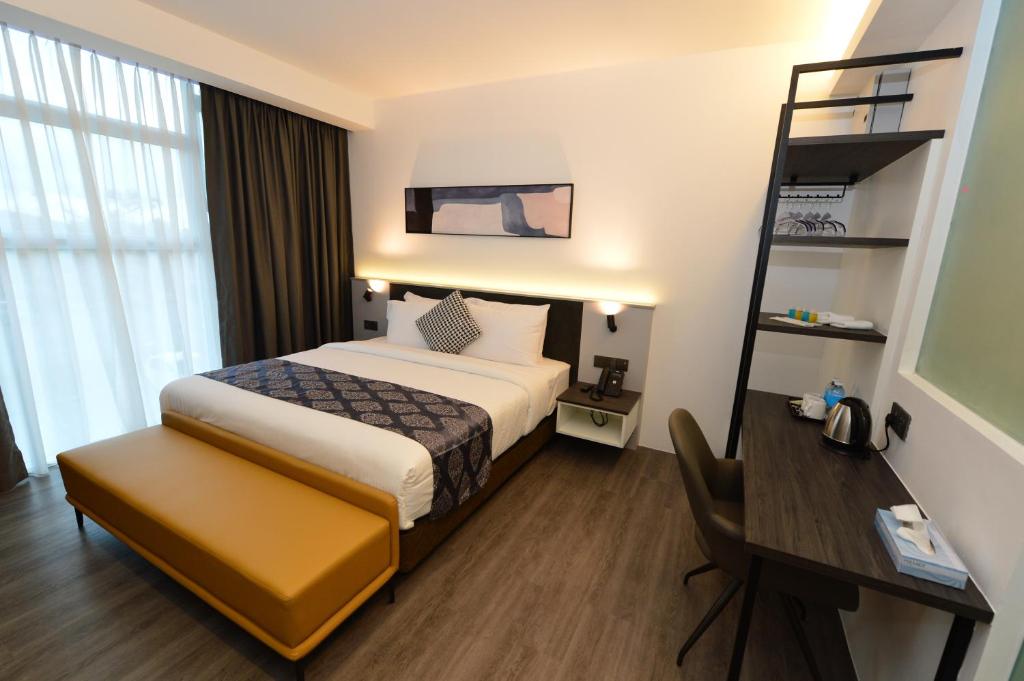 Postel nebo postele na pokoji v ubytování Rume Hotel