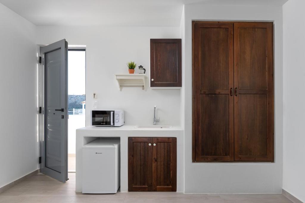 Kuchyň nebo kuchyňský kout v ubytování Stegna Akti Luxury Suites