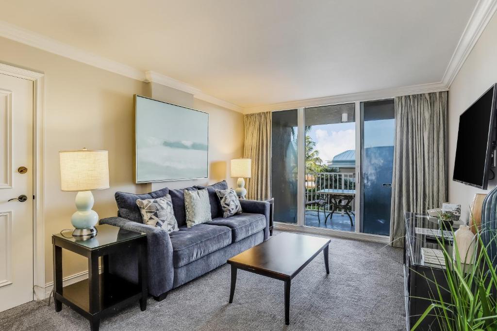 a living room with a couch and a table at Marco Beach Ocean Resort 607 in Marco Island