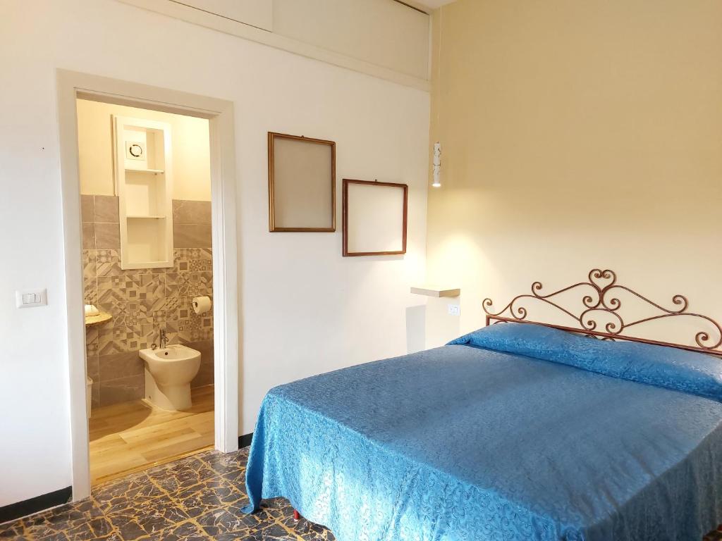 Ένα ή περισσότερα κρεβάτια σε δωμάτιο στο HAPPY LUCCA Casa Vacanze