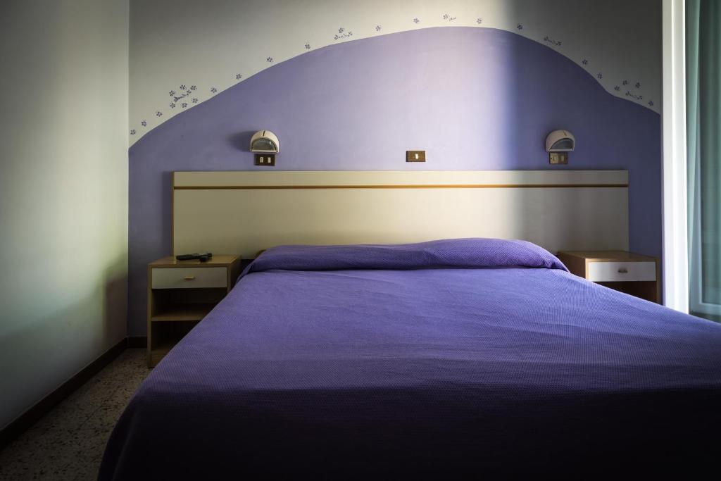 Łóżko lub łóżka w pokoju w obiekcie Hotel Doria