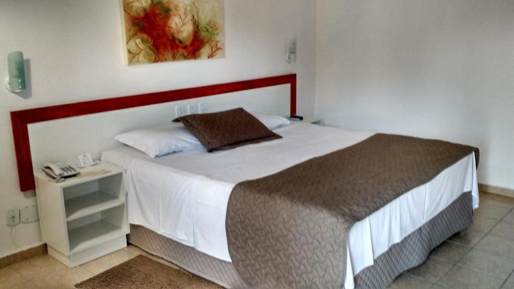 Postel nebo postele na pokoji v ubytování Hotel Pousada Lord