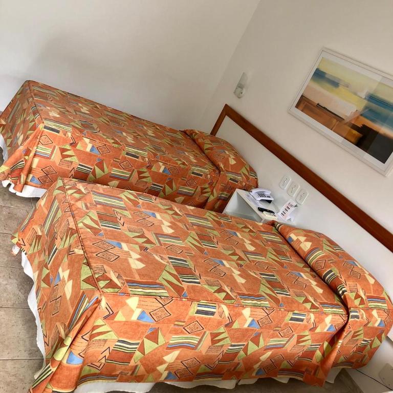 Postel nebo postele na pokoji v ubytování Hotel Pousada Lord