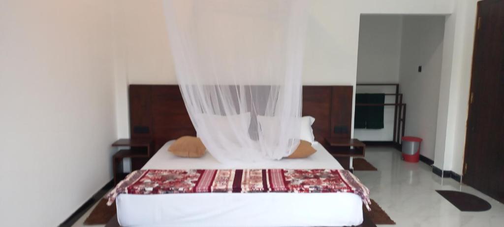 Postel nebo postele na pokoji v ubytování Ella Odyssey Inn
