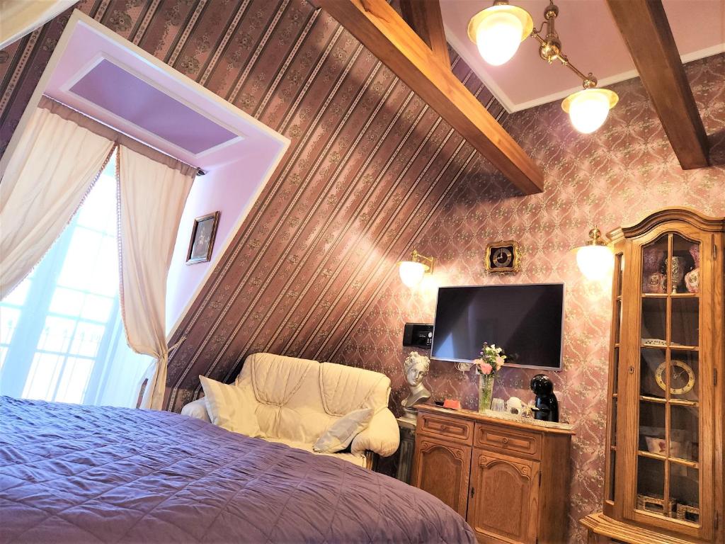 Postel nebo postele na pokoji v ubytování Rezidence Zámeček - Boutique Hotel