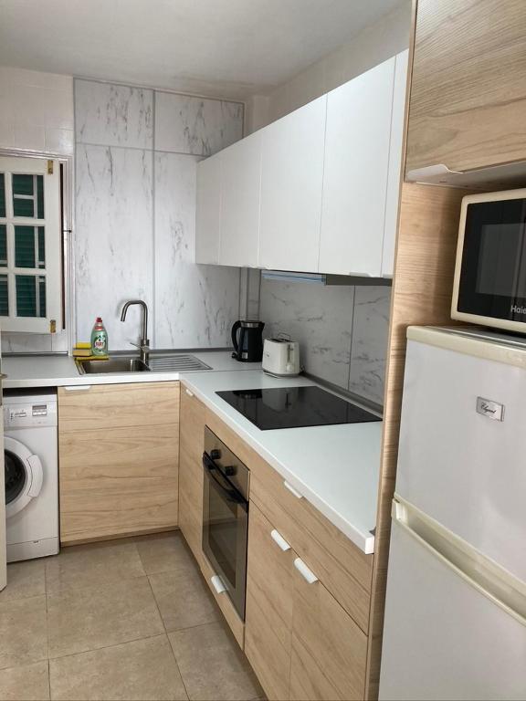 Kuchyň nebo kuchyňský kout v ubytování Apartamento Marina