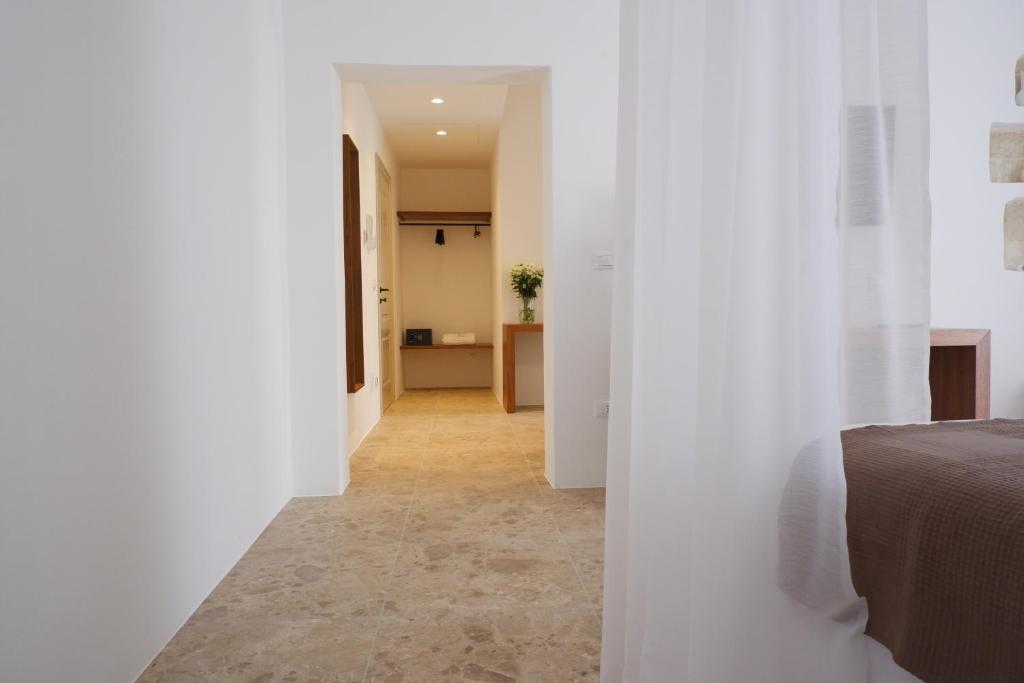 Postel nebo postele na pokoji v ubytování PALAZZO CAMERLENGO Suites Relax