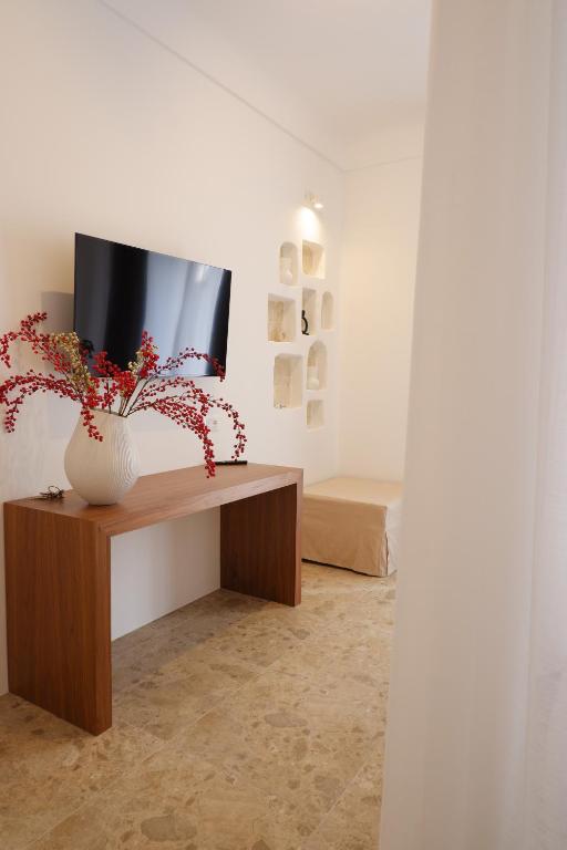 TV a/nebo společenská místnost v ubytování PALAZZO CAMERLENGO Suites Relax