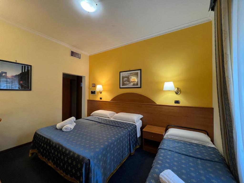 Postel nebo postele na pokoji v ubytování Baltik Guesthouse
