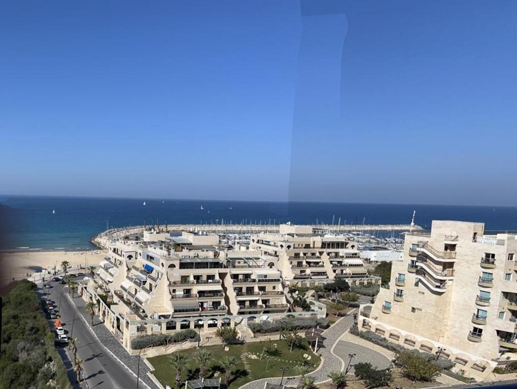 an aerial view of a large building near the beach at Blue Sea Suite in Ashqelon