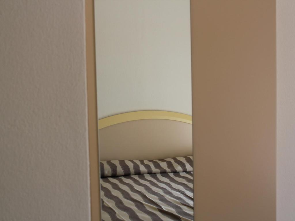 Postel nebo postele na pokoji v ubytování Hotel Marina