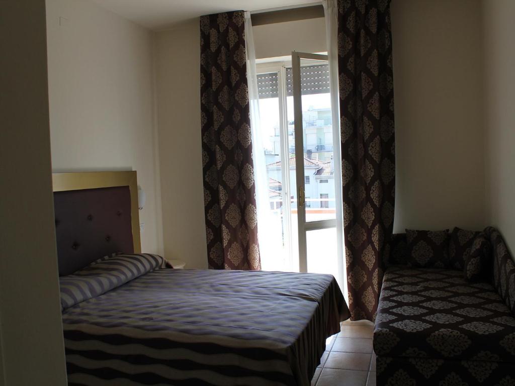 Postel nebo postele na pokoji v ubytování Hotel Marina