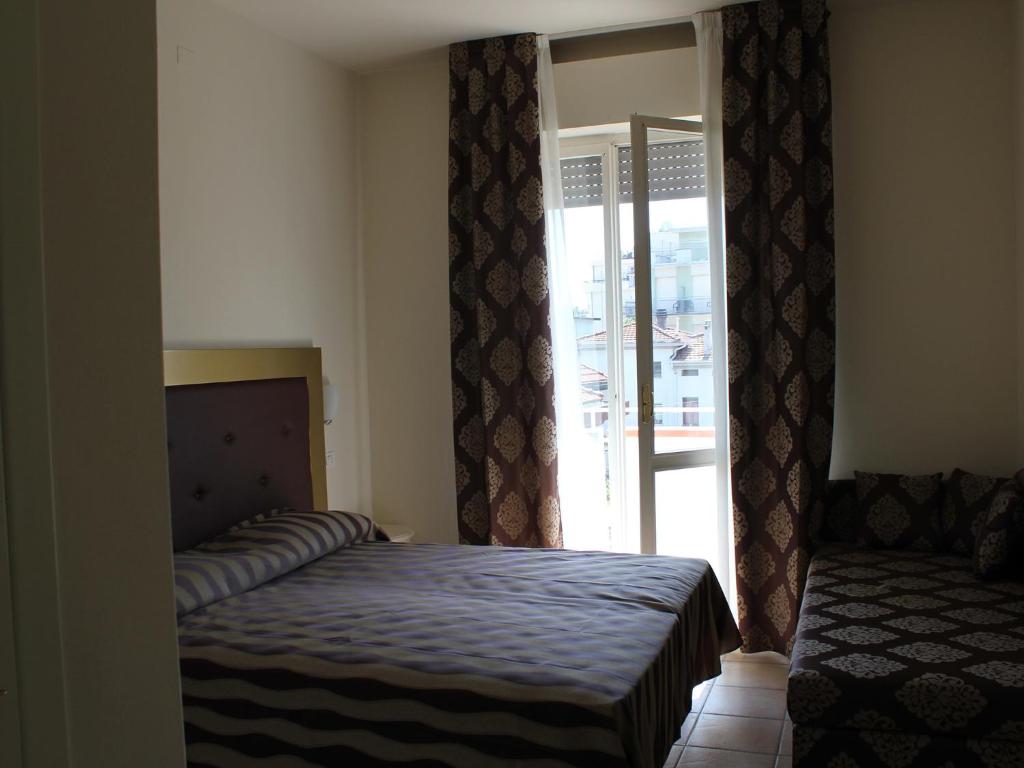 Postel nebo postele na pokoji v ubytování Hotel Marina