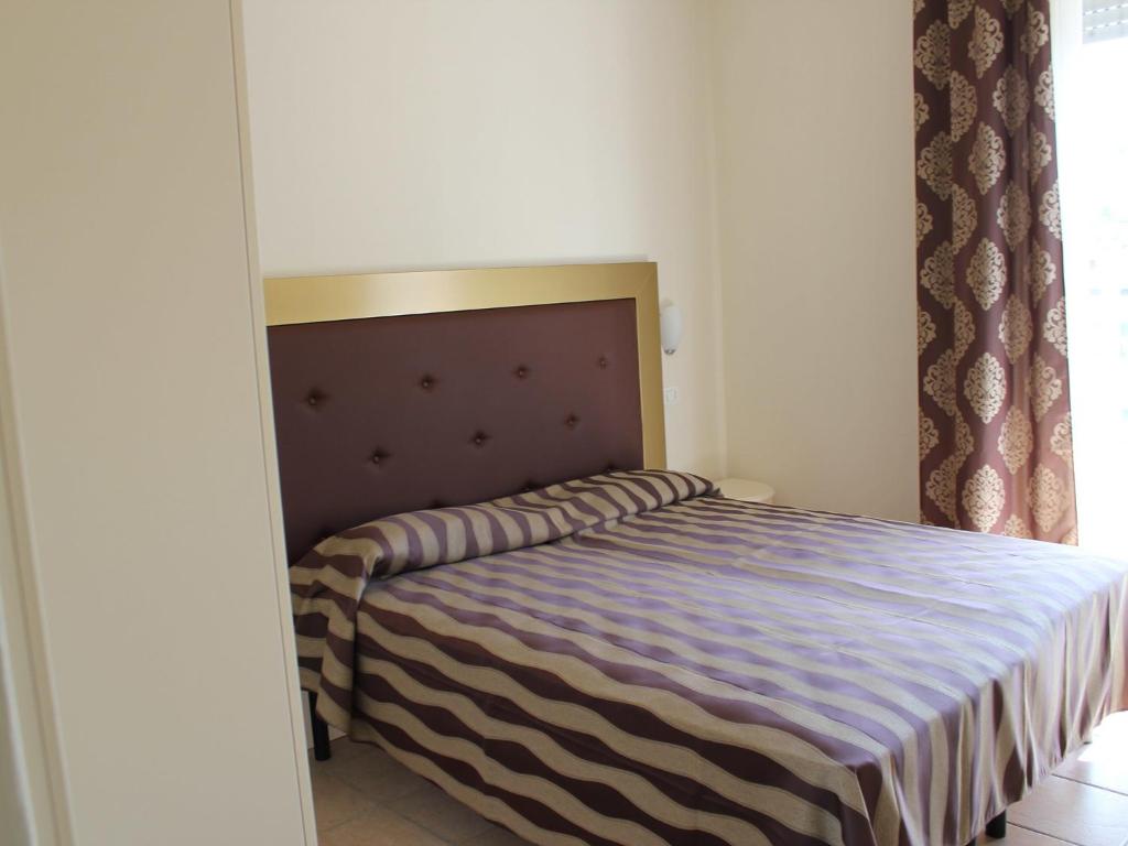 Postel nebo postele na pokoji v ubytování Hotel Marina