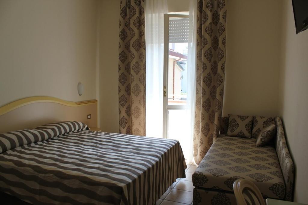 Postel nebo postele na pokoji v ubytování Hotel Marina