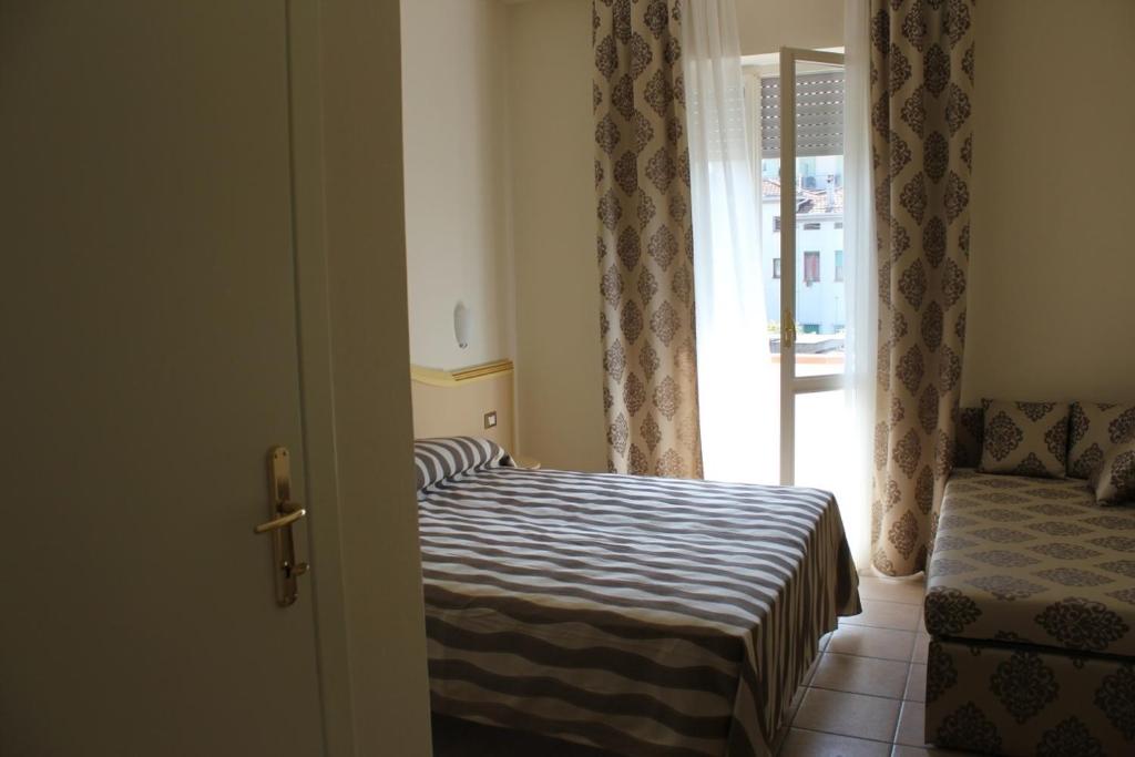 Postel nebo postele na pokoji v ubytování Hotel Marina