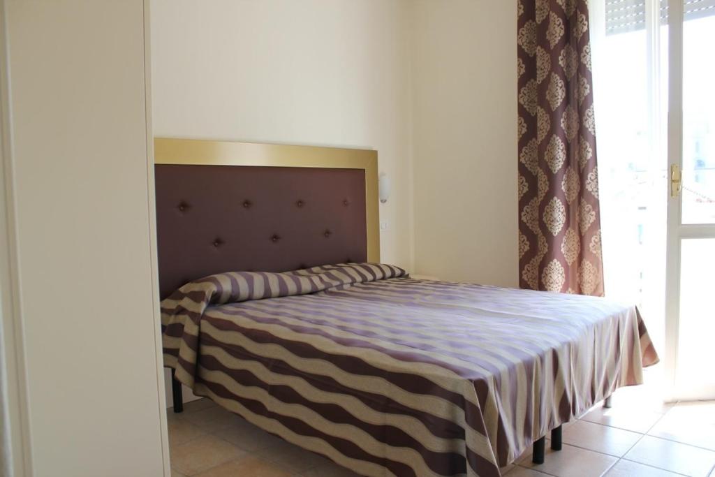 Postel nebo postele na pokoji v ubytování Hotel Marina
