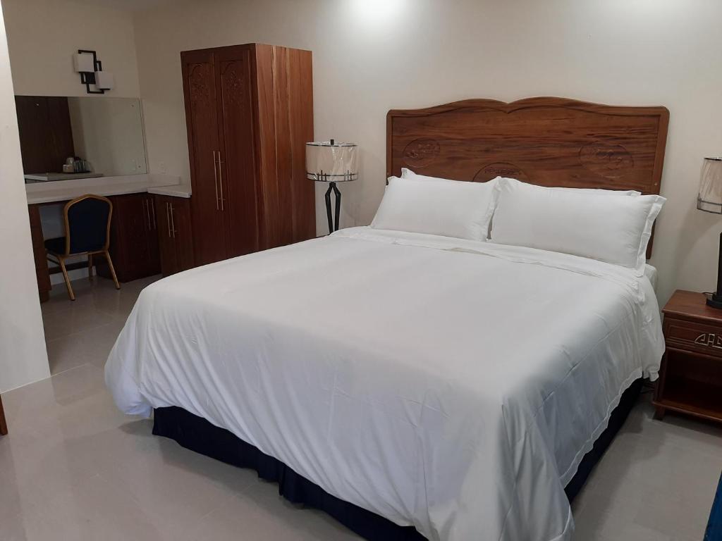 Postel nebo postele na pokoji v ubytování PESHERES INN & SPA