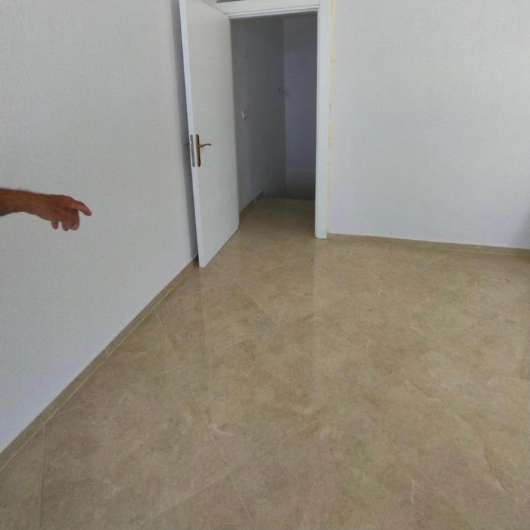 an empty room with a door and a tile floor at Ferienhaus mit Meerblick in Bodrum City