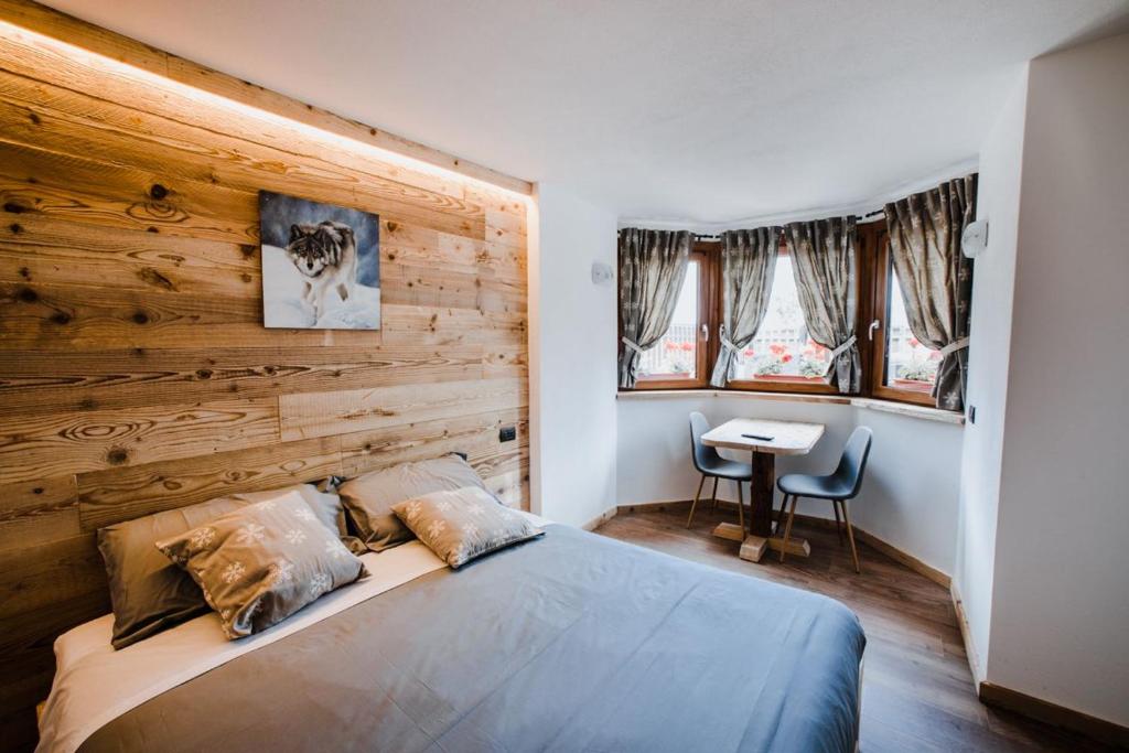 Postel nebo postele na pokoji v ubytování Atelier della Montagna