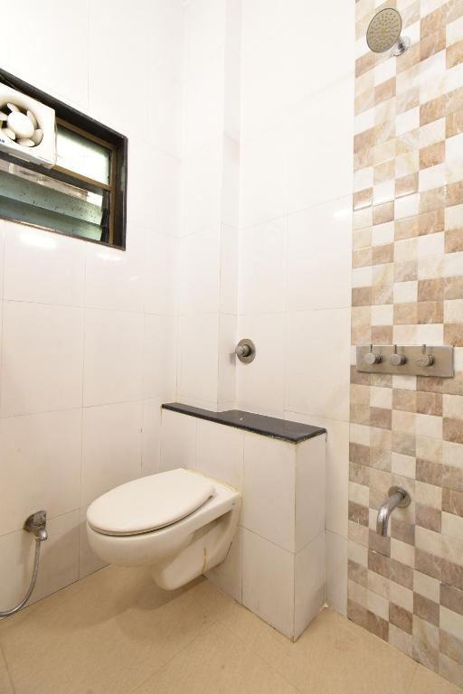 Koupelna v ubytování Hotel Sai Sparsh