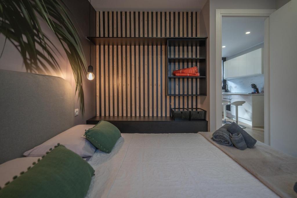A bed or beds in a room at The Little Jewel with Ocean View - Las Americas