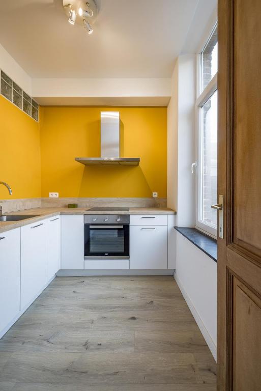 Kuchyň nebo kuchyňský kout v ubytování Gîtes in Huy - Appartements chaleureux dans le centre de Huy