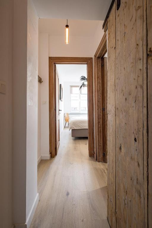Postel nebo postele na pokoji v ubytování Gîtes in Huy - Appartements chaleureux dans le centre de Huy
