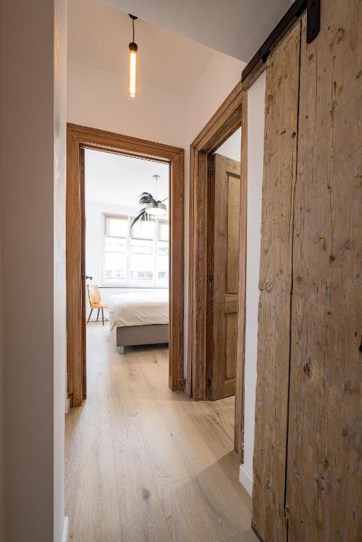 Postel nebo postele na pokoji v ubytování Gîtes in Huy - Appartements chaleureux dans le centre de Huy