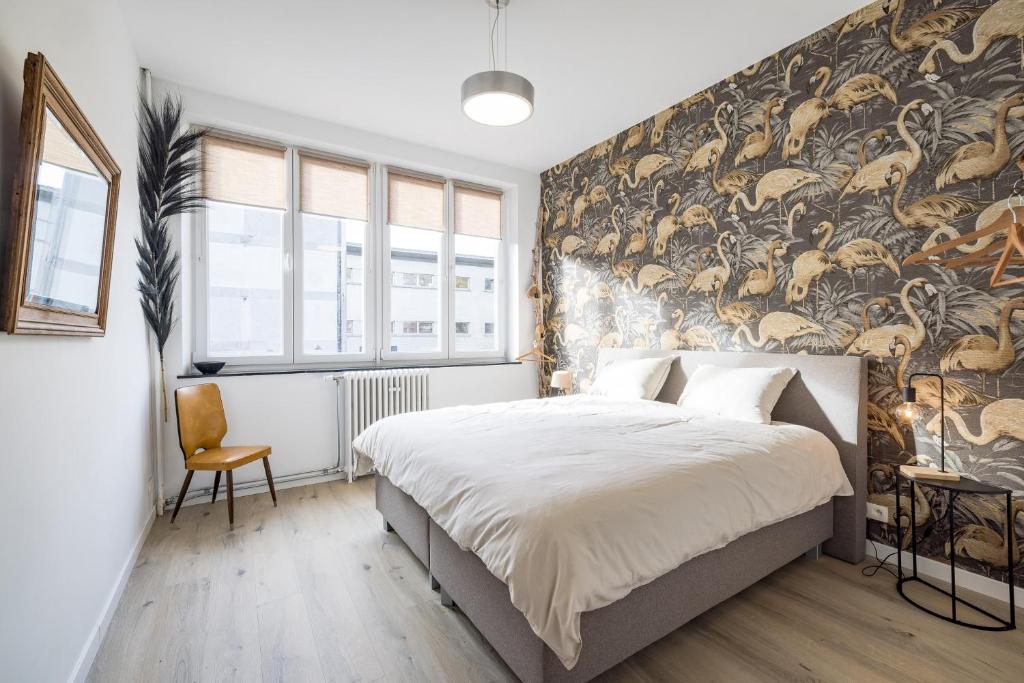 Postel nebo postele na pokoji v ubytování Gîtes in Huy - Appartements chaleureux dans le centre de Huy